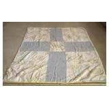 64 x 67 old quilt with a tear and staining