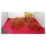 Carnival Glass grape pattern pitcher, 8 tumblers