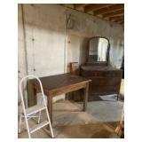 Step stool, old wooden table and vintage dresser