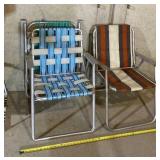 Three lawn chairs, green one has some wear signs