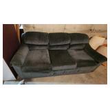 3 cushion couch in basement
