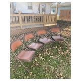 Four padded fold up chairs