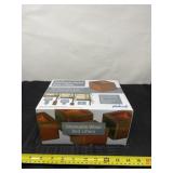 New in box set of 4 stackable wood bed lifters