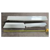 Three white hanging shelves