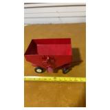 Red metal toy grain wagon