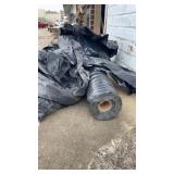 Roll of black plastic , 43 inches long approx