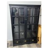 black wooden display cabinet with glass doors and
