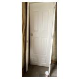 White door and casing. Door measures 28 inches