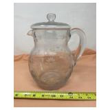 Clear glass pitcher with etched floral and leaf