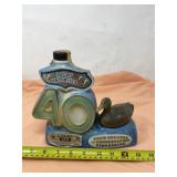 Ducks Unlimited bourbon decanter with some liquor