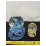 Sea World Dolphin and Cancun Mexico water globes.