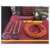 Extension cord, level, two saws and Black &