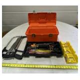 Plastic tool box with saws, tools and miter box.