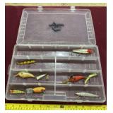 Okeechobee plastic tackle box with fishing lures.