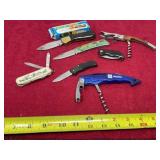 Assortment of pocket knives, wine bottle opener