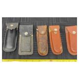 Nighthawk V  and other pocket knives with cases.