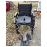Wheel chair with padded cushion