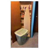 Contents on shelves ironing board iron hamper,
