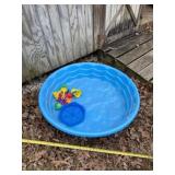 Kids swimming pool and sand toys.