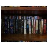 Stephen King and two rows of books on shelf.