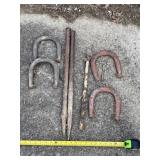 Set of horse shoes with stakes.