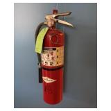 Fire extinguisher and wall hanging bracket