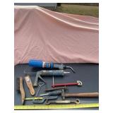 Hammer, propane torch, caulking gun, wire brushes