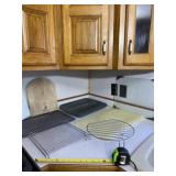Roaster tray, wire racks and cutting boards.