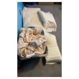 Tote full of sheets, comforter, and pillows,