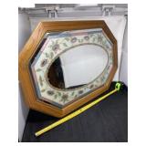 Mirror with floral print.