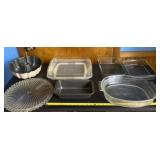 Pyrex dishes, glass tray, loaf pan and bundt pan.