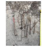 Trap stakes and animal neck grab tool.