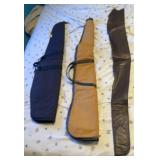 Two cloth gun cases and a sleeve