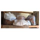 Seven bags of bedspreads comforters mattress pads