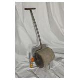 Linoleum floor roller.