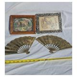 Brass wall fans, framed cross-stitch pictures