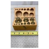 Ohaus Brass balance scale weights in a wooden