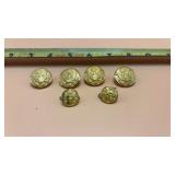 U.S. Army dress uniform buttons, featuring the