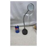 gooseneck magnifying glass with a weighted base.