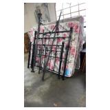 Black metal bed frame set with a matching