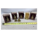Brass pear-shaped bells in their original boxes,