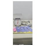 Scale, shower head straws, clean up bags