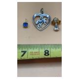 Assorted charms, including a blue stone charm, a