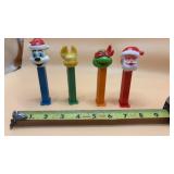 4 PEZ candy dispensers, featuring holiday and
