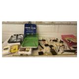 Paint pans, brushes and rollers and supplies.