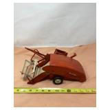 Tru Scale combine pull type reaper.