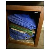 All tarps and wood cabinet.