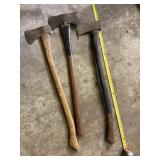 Three wooden handled axes.