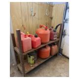 Shelf with gas cans some missing lids.