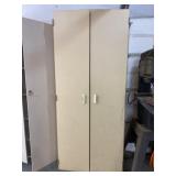 Tall wood storage cabinet measures 32.5 wide x 22